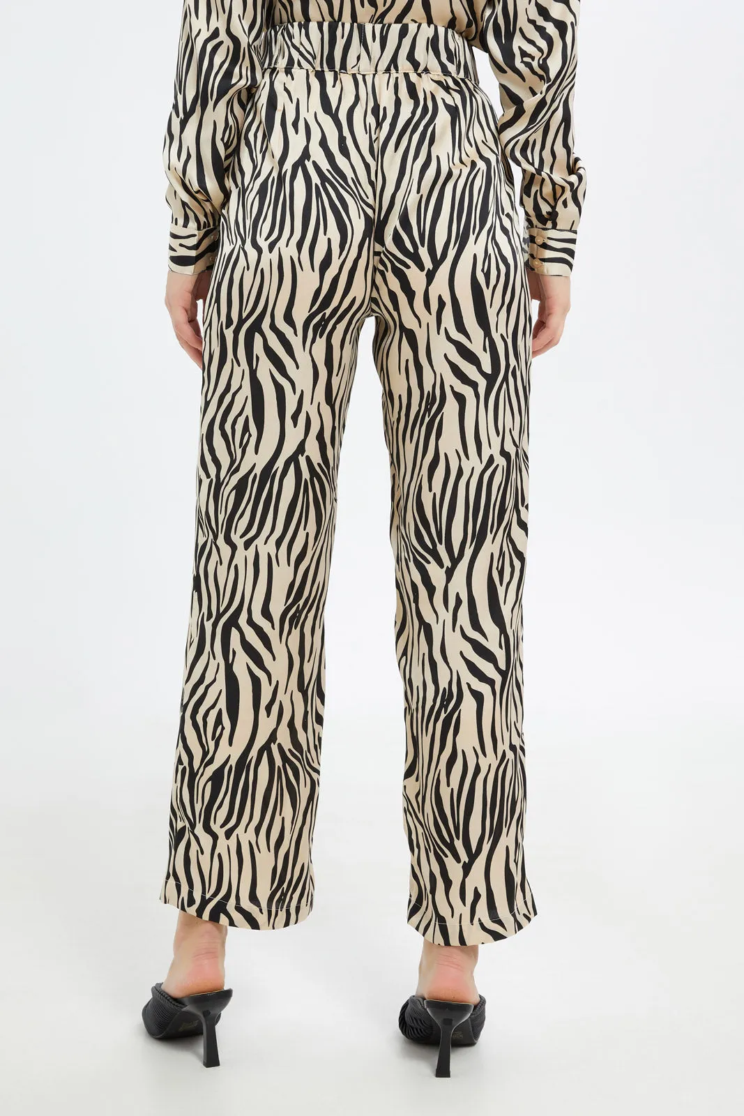 Women Beige And Black Allover Print Flared Trouser