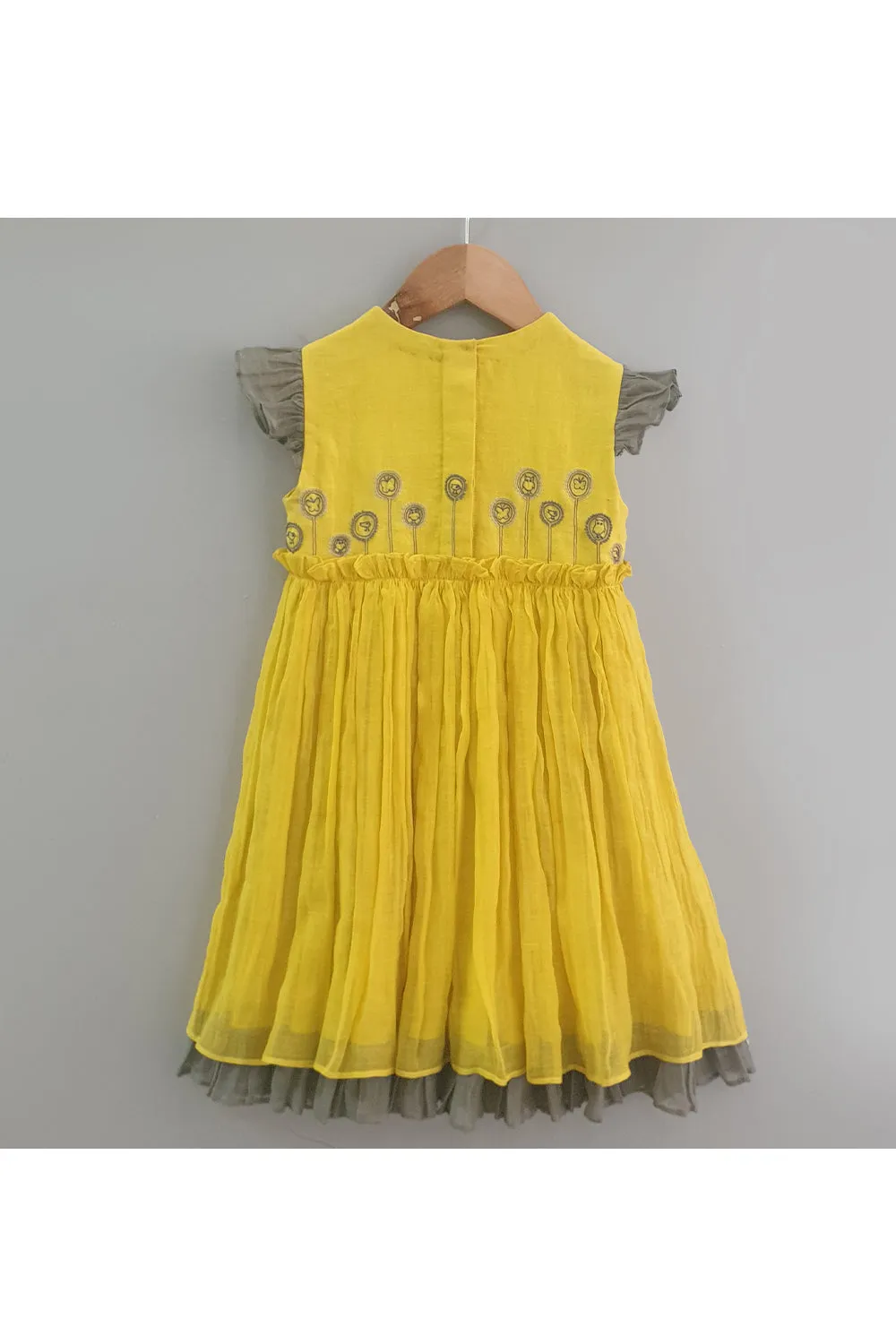 Yellow embroidered ruffled and layered dress